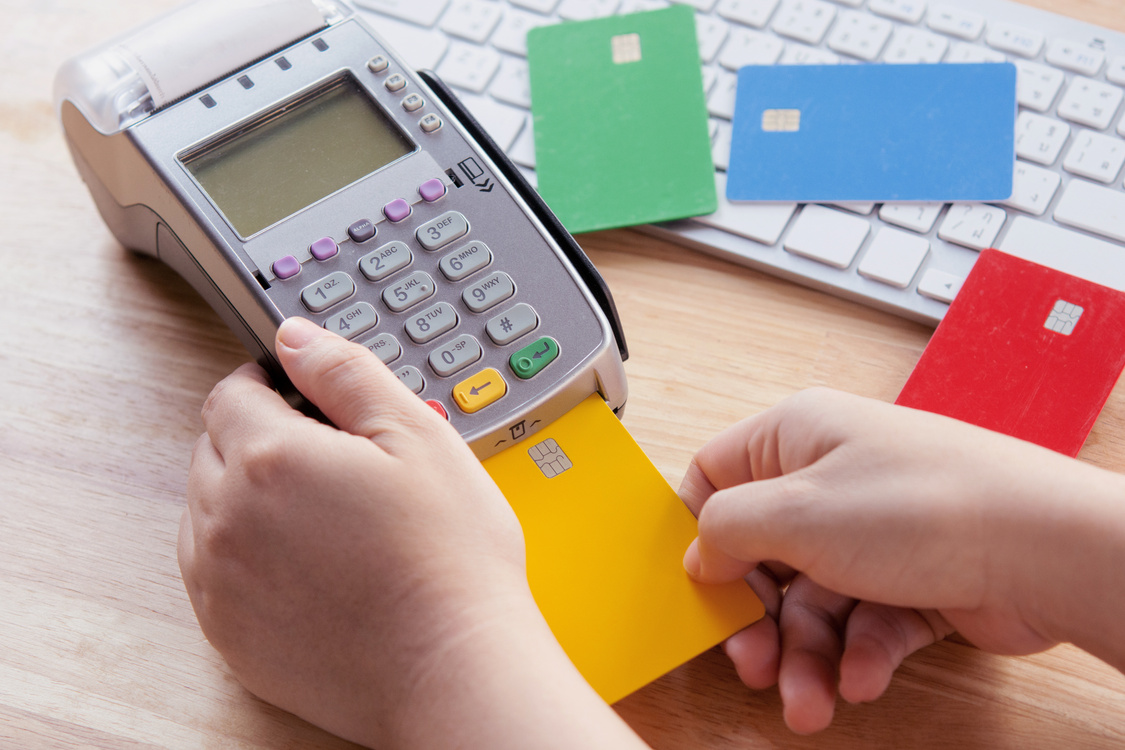 Credit card payment with EDC machine or credit card terminal.